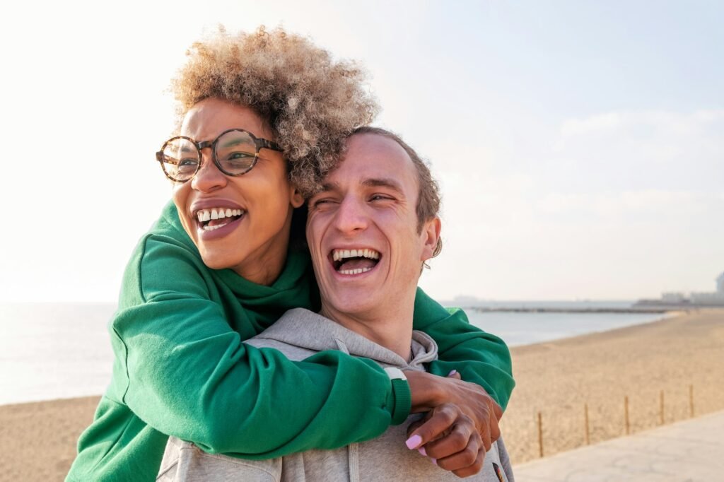 happy young couple hugging and laughing